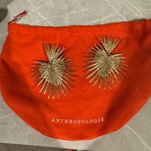 Gold sunburst earrings with pouch
